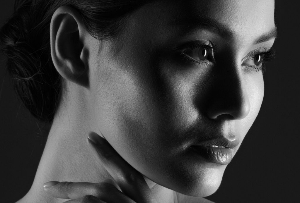 Close-up of woman's face in black and white