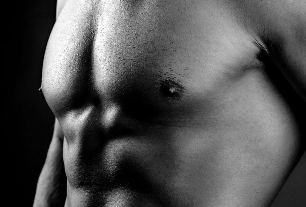 Male upper torso in black and white