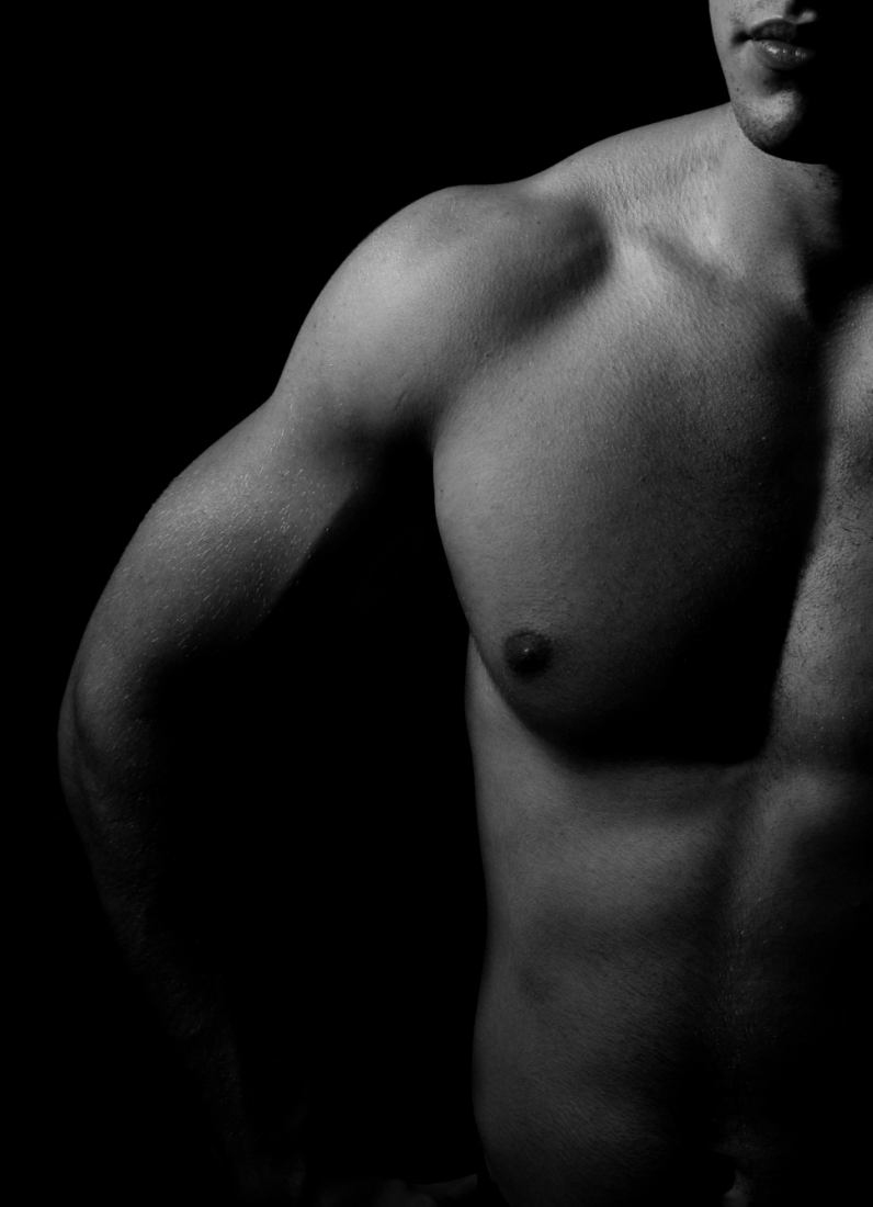 Male upper body and arm in black and white